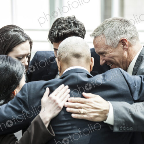 Mixed race group of business people in an informal team building meeting. Mixed race group of business people in an informal team building meeting.
