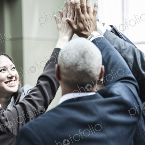 Mixed race group of business people in an informal team building meeting. Mixed race group of business people in an informal team building meeting.