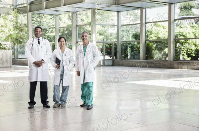 Mixed race group of doctors in lab coats.