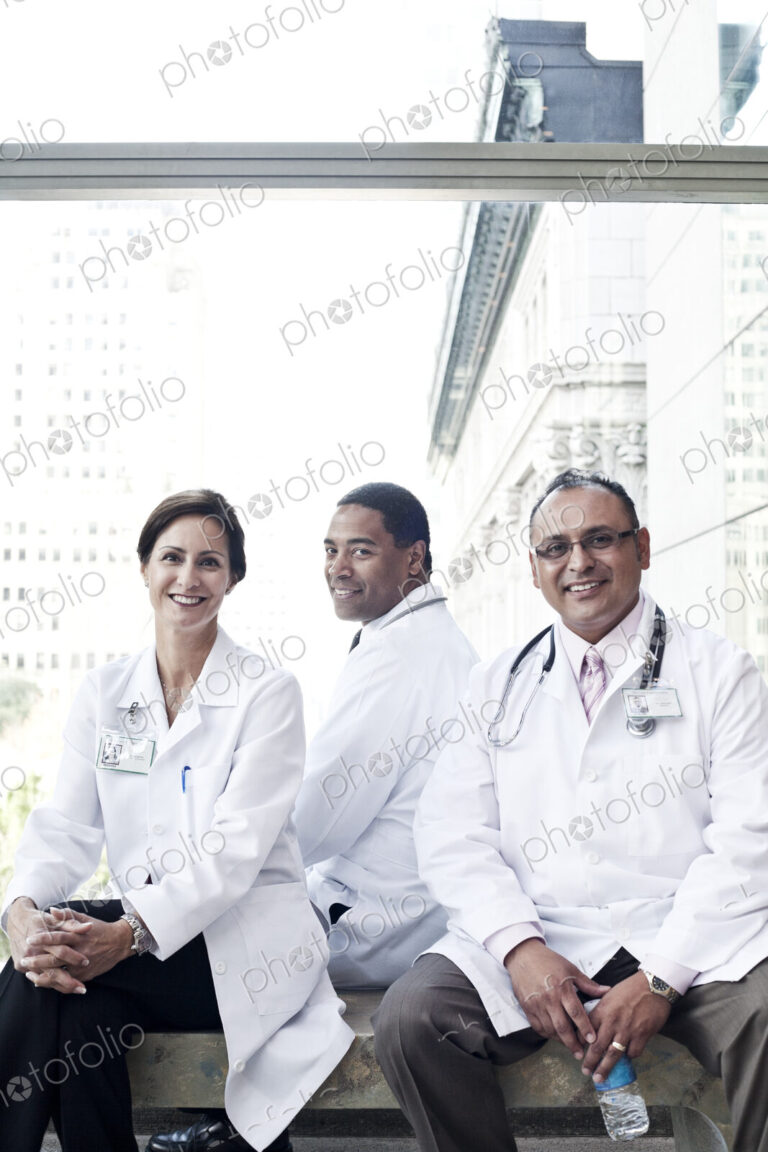 Mixed race group of doctors in lab coats.