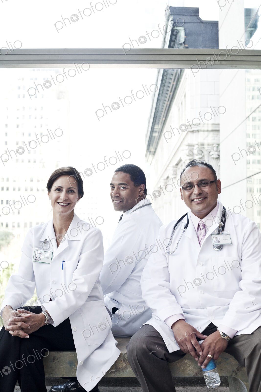 Mixed race group of doctors in lab coats.