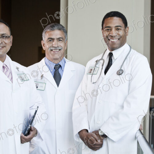 Mixed race group of doctors in lab coats. Mixed race group of doctors in lab coats.