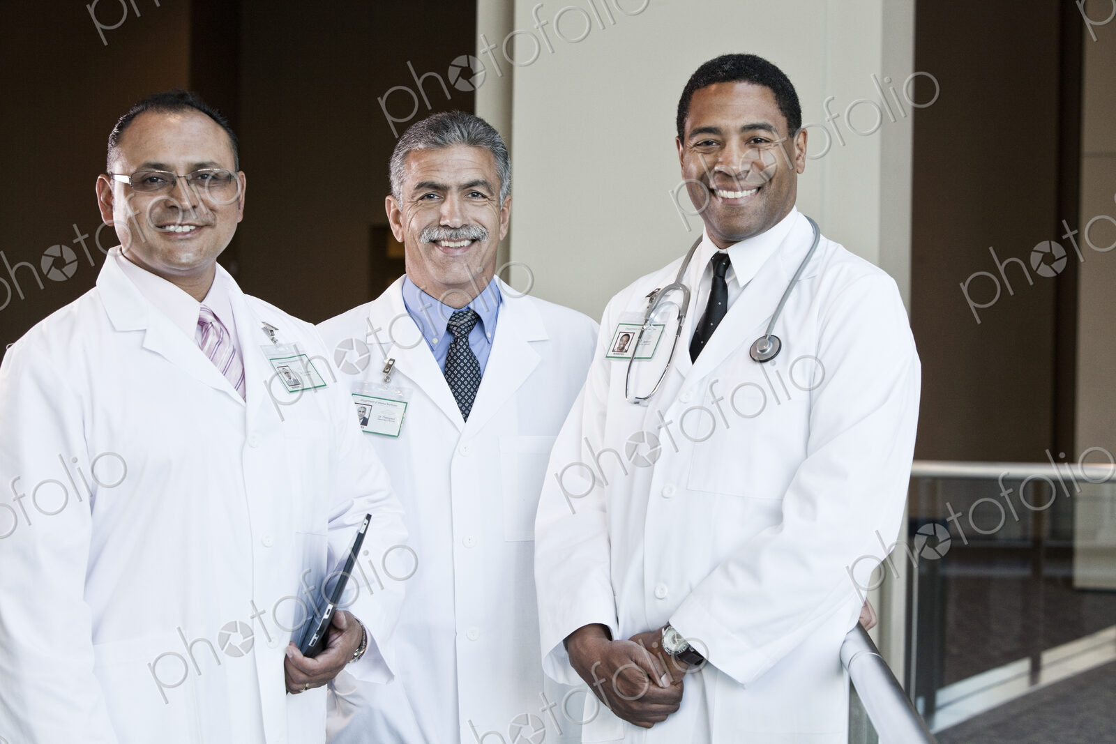 Mixed race group of doctors in lab coats.