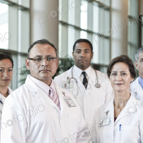 Mixed race group of doctors in lab coats. Mixed race group of doctors in lab coats.