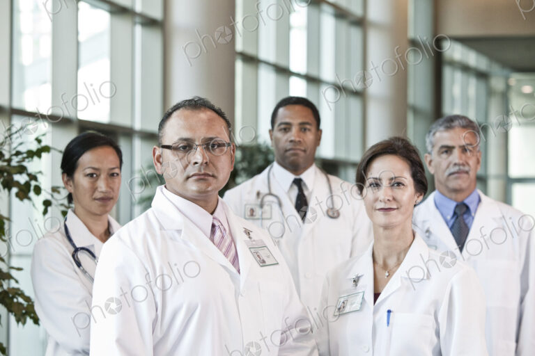 Mixed race group of doctors in lab coats.
