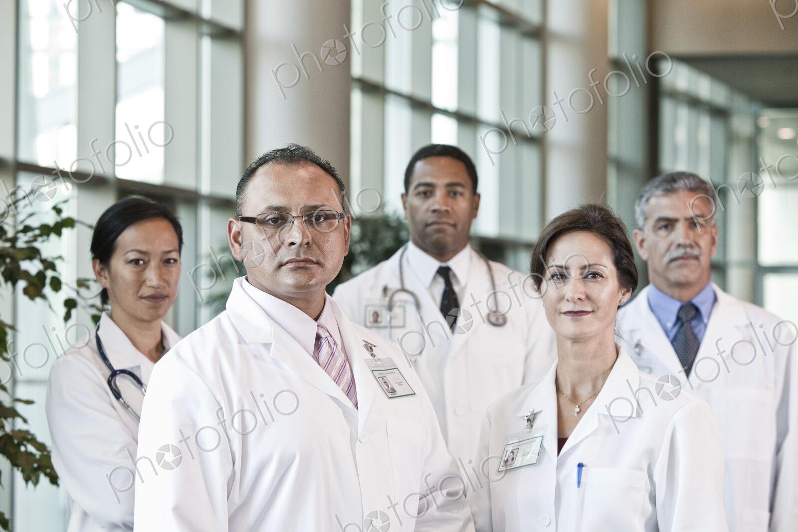 Mixed race group of doctors in lab coats.