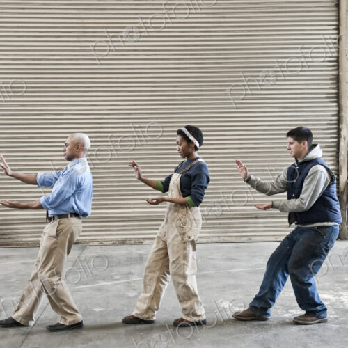 Mixed race group of workers and a black man management person taking a break on the…