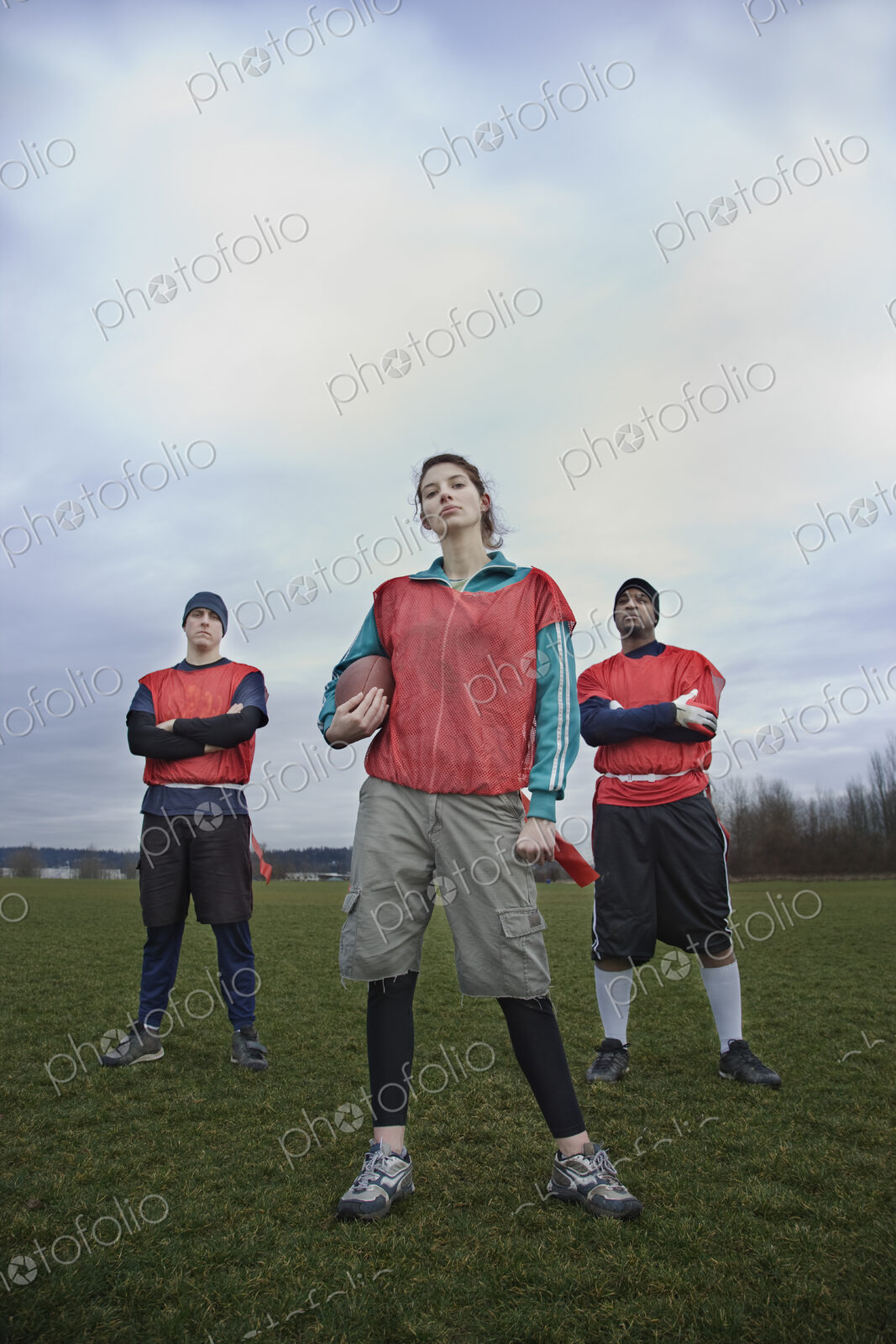 Mixed race members of a team of American football players.