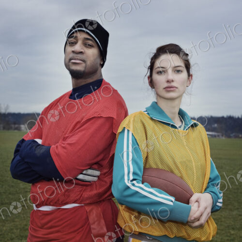 Mixed race members of a team of American football players.