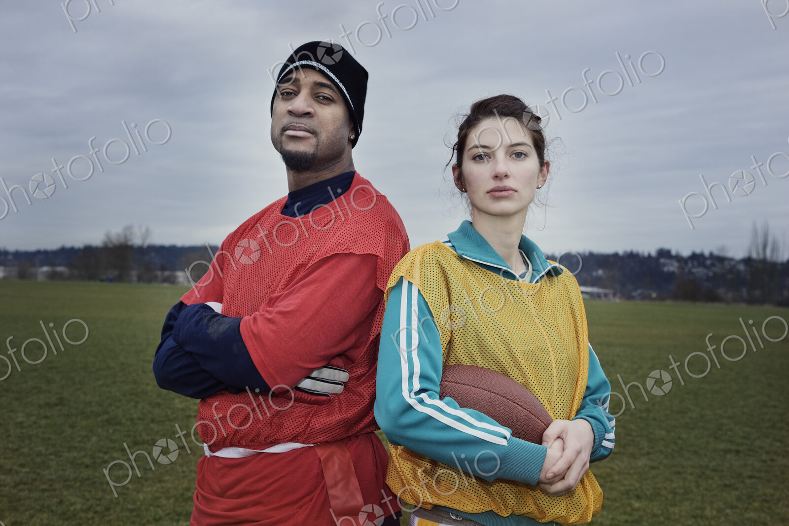 Mixed race members of a team of American football players.
