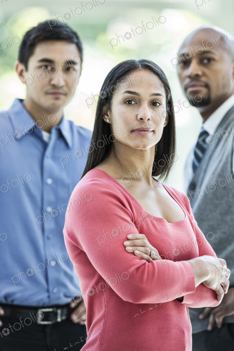 Mixed race team of business people at a table in a business center.