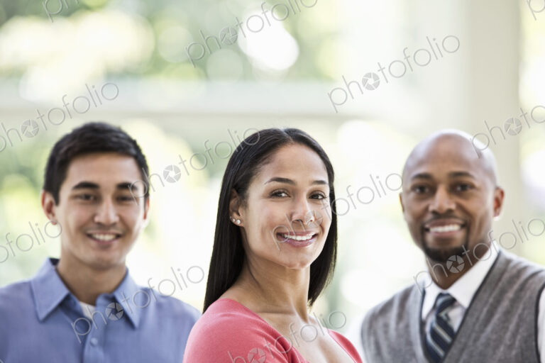 Mixed race team of business people at a table in a business center.
