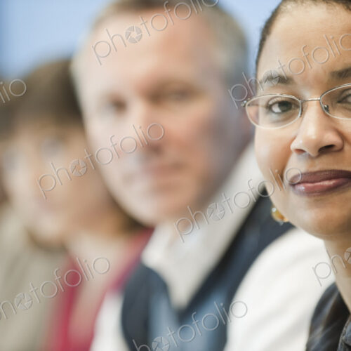 Mixed race team of business people led by a black businesswoman. Mixed race team of business people led by a black businesswoman.