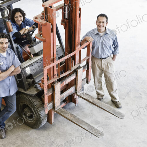 Mixed race team of workers and management person at a landscape company. Mixed race team of workers and management person at a landscape company.