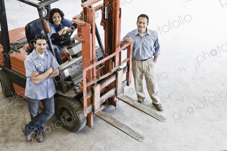 Mixed race team of workers and management person at a landscape company.