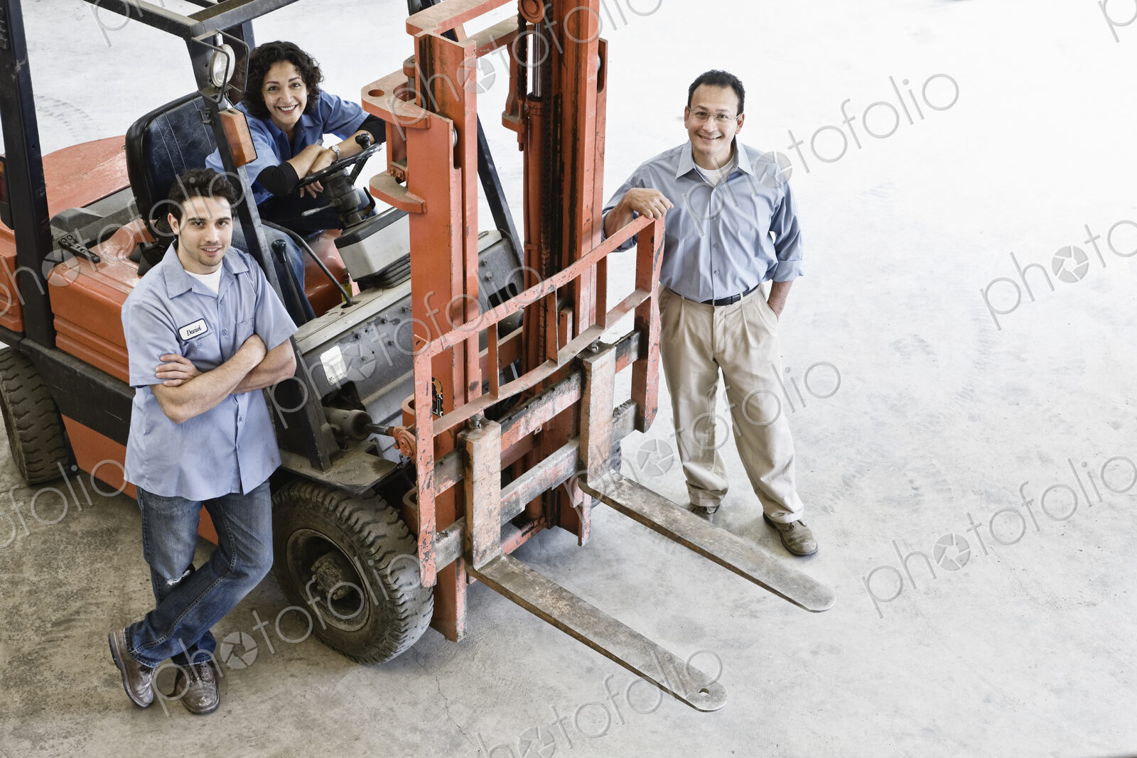 Mixed race team of workers and management person at a landscape company.