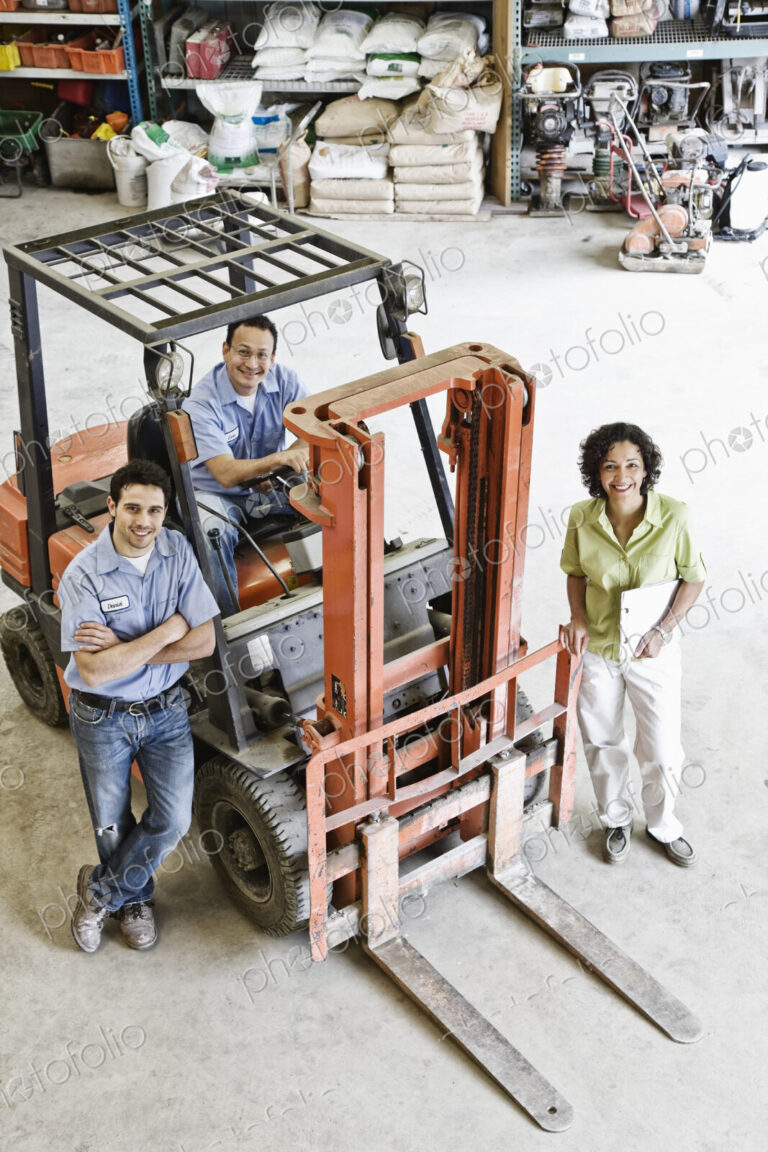 Mixed race team of workers and management person at a landscape company.
