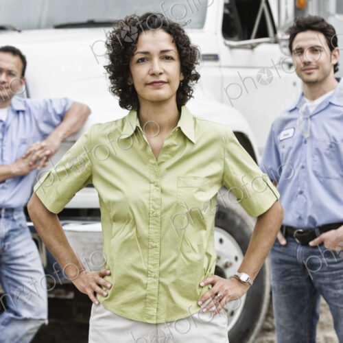 Mixed race team of workers at a landscape company with a woman in the lead. Mixed race team of workers at a landscape company with a woman in the lead.