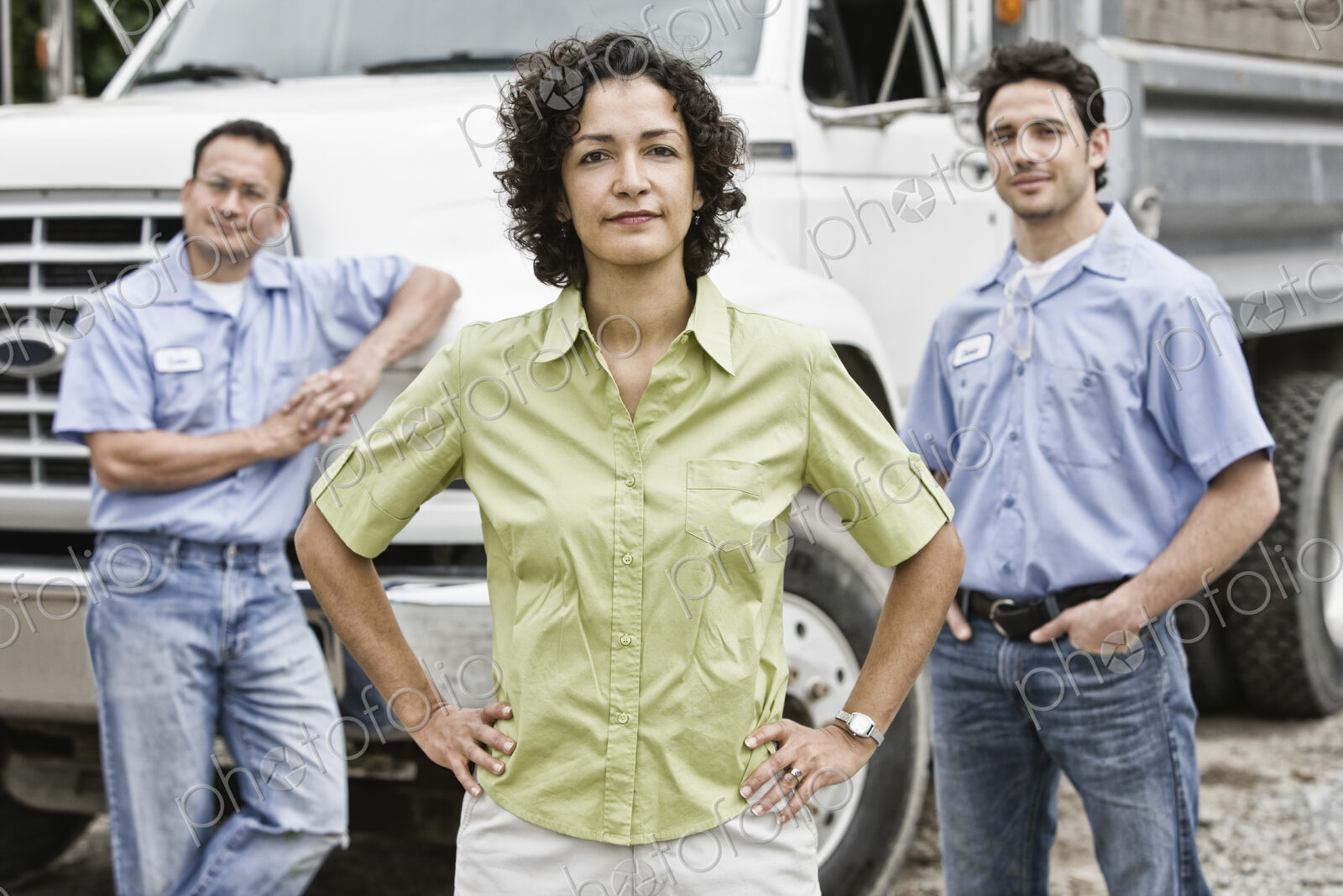 Mixed race team of workers at a landscape company with a woman in the lead.