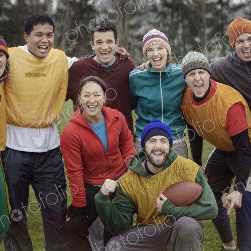 Mixed race team portrait of a group of friends playing American Flag Football Mixed race team portrait of a group of friends playing American Flag Football