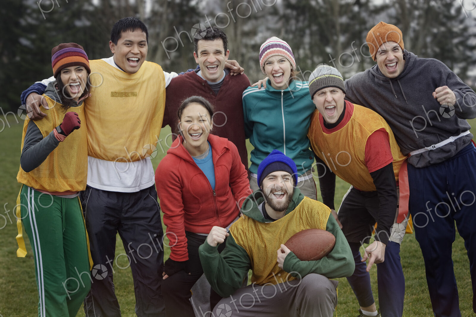 Mixed race team portrait of a group of friends playing American Flag Football