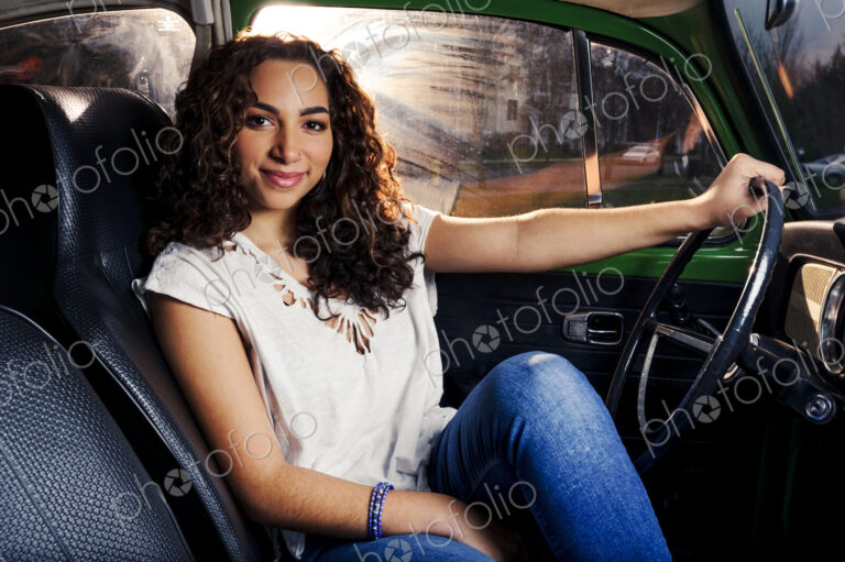 Mixed race woman driving car