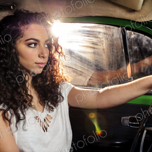 Mixed race woman driving vintage car Mixed race woman driving vintage car