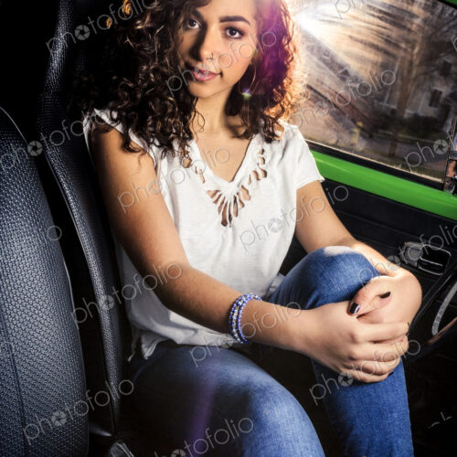 Mixed race woman sitting in car Mixed race woman sitting in car
