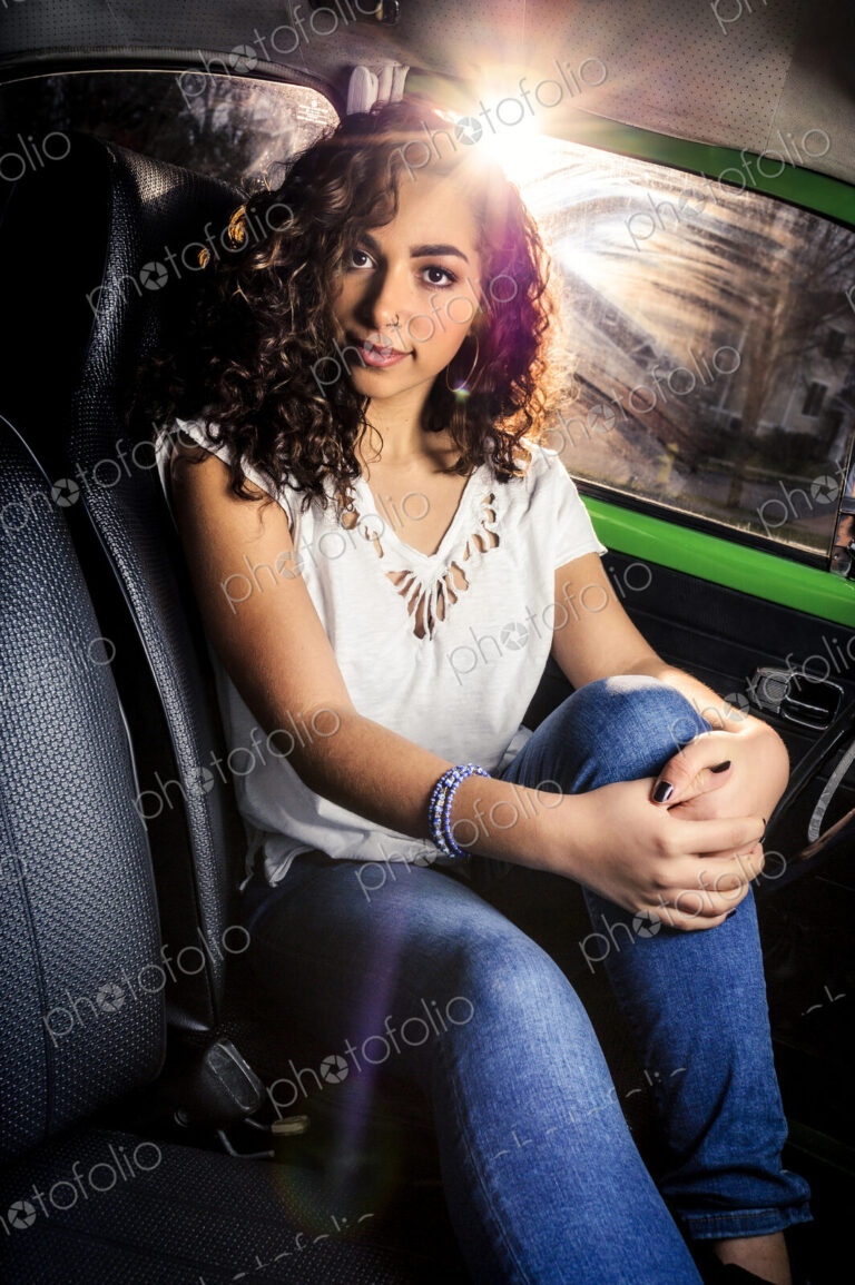 Mixed race woman sitting in car
