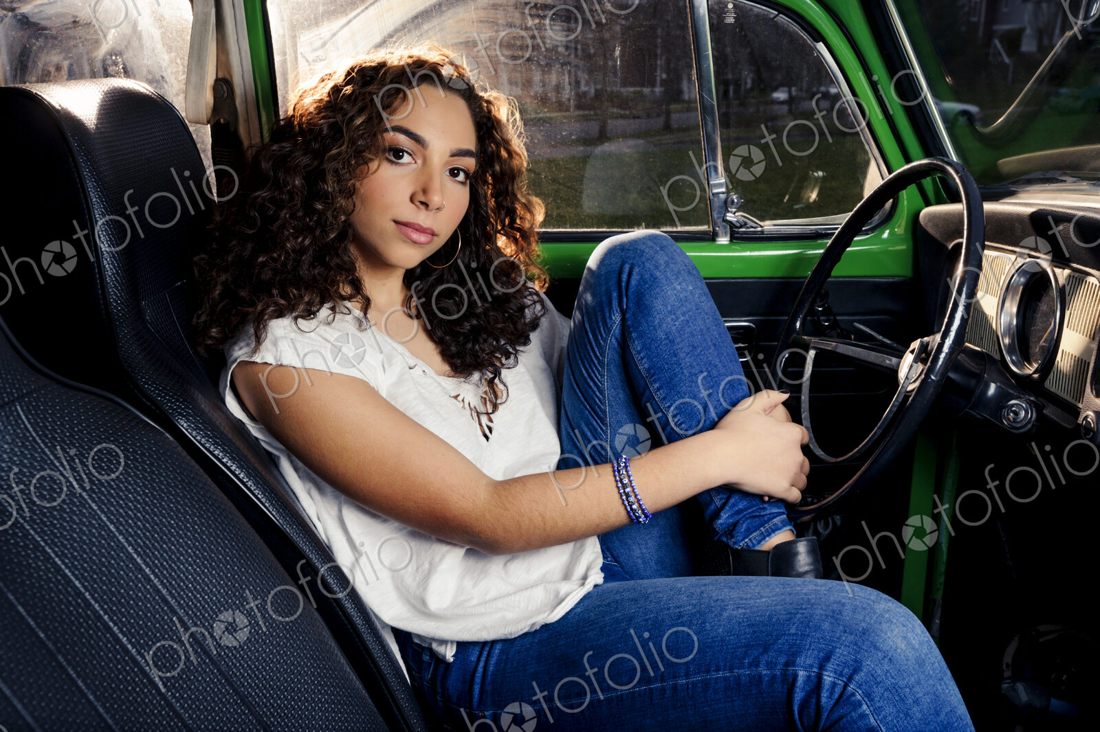 Mixed race woman sitting in car