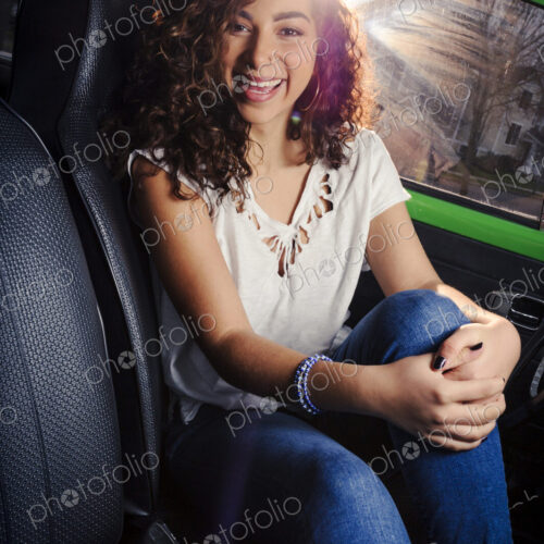Mixed race woman smiling in car Mixed race woman smiling in car