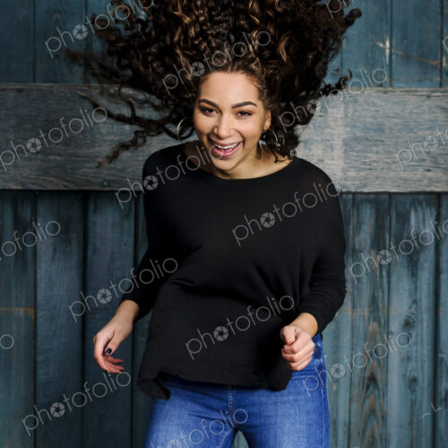 Mixed race woman tossing her hair Mixed race woman tossing her hair