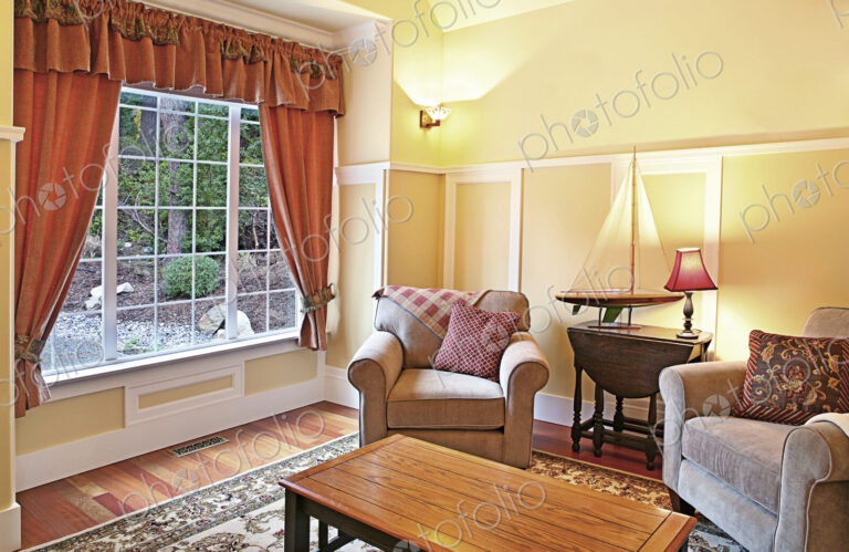 Model sailboat in livingroom with armchairs