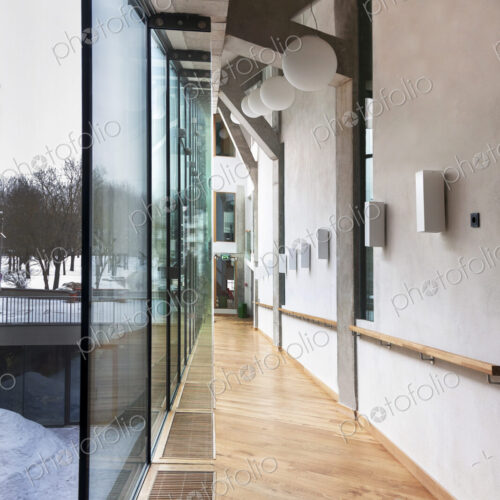 Modern building in a university, glass walls and an indoor walkway Modern building in a university, glass walls and an indoor walkway