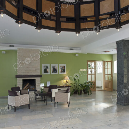 Modern building interior, hotel, reception area, pillars and tiled floor, fireplace…