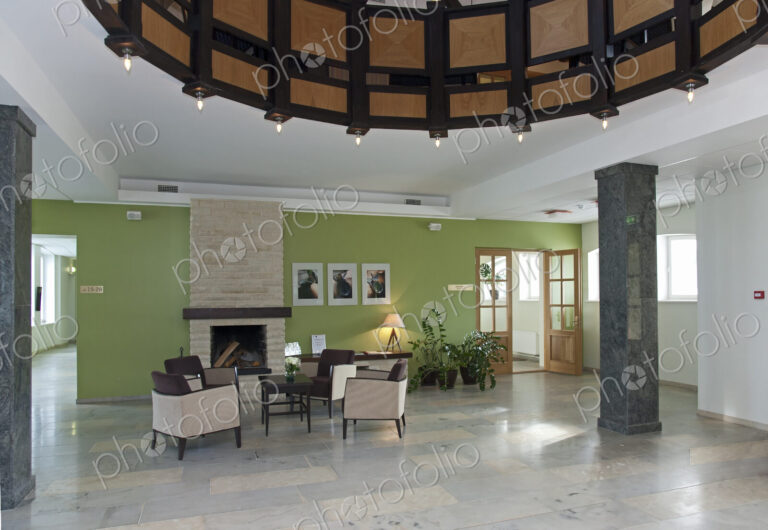 Modern building interior, hotel, reception area, pillars and tiled floor, fireplace…