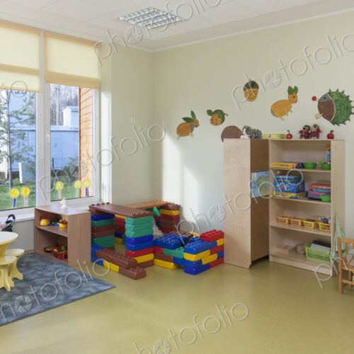 Modern children's day care or pre-school building, open indoors play area