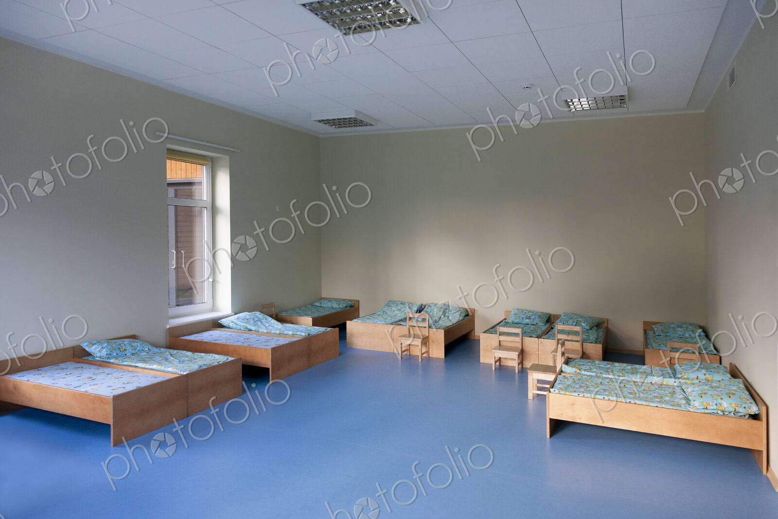 Modern day care nursery or pre-school kindergarten school, bedrooms for nap time