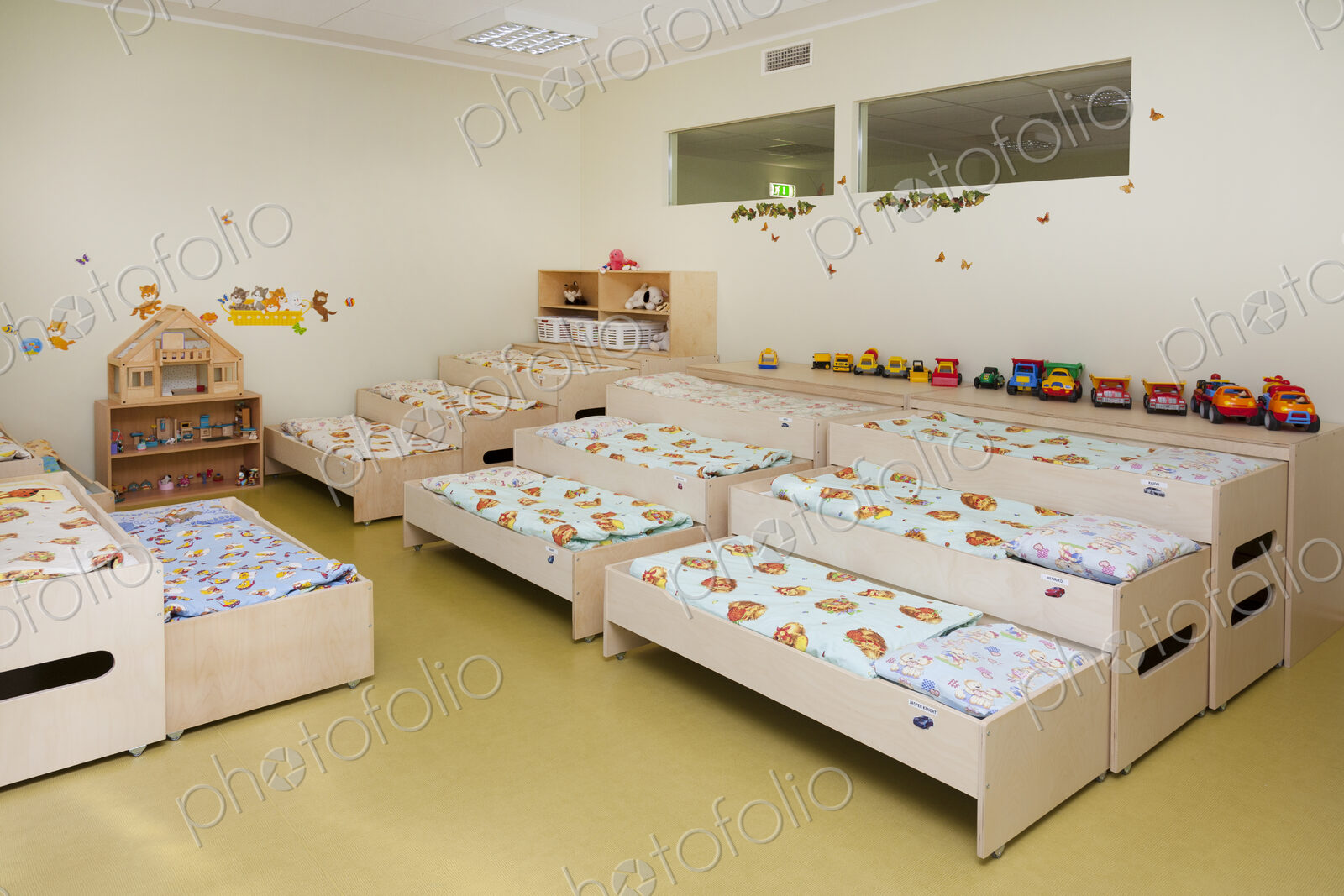Modern day care nursery or pre-school kindergarten school, bedrooms for nap time, pull…