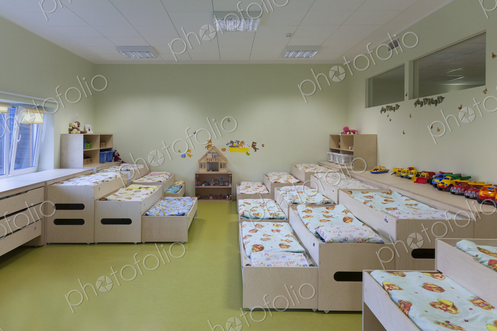 Modern day care nursery or pre-school kindergarten school, bedrooms for nap time, pull…