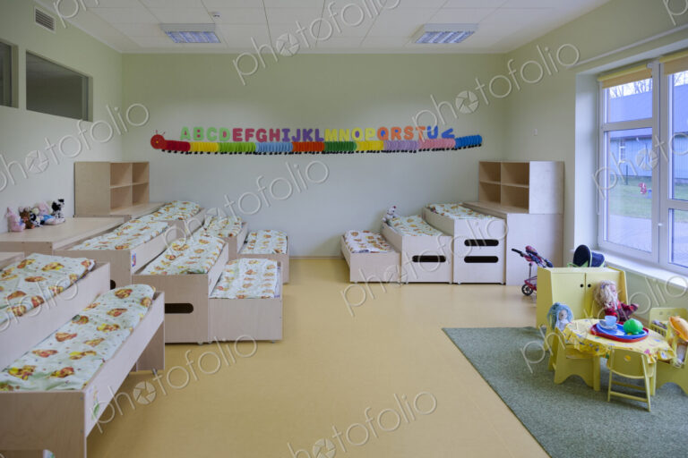 Modern day care nursery or pre-school kindergarten school, bedrooms for nap time, pull…