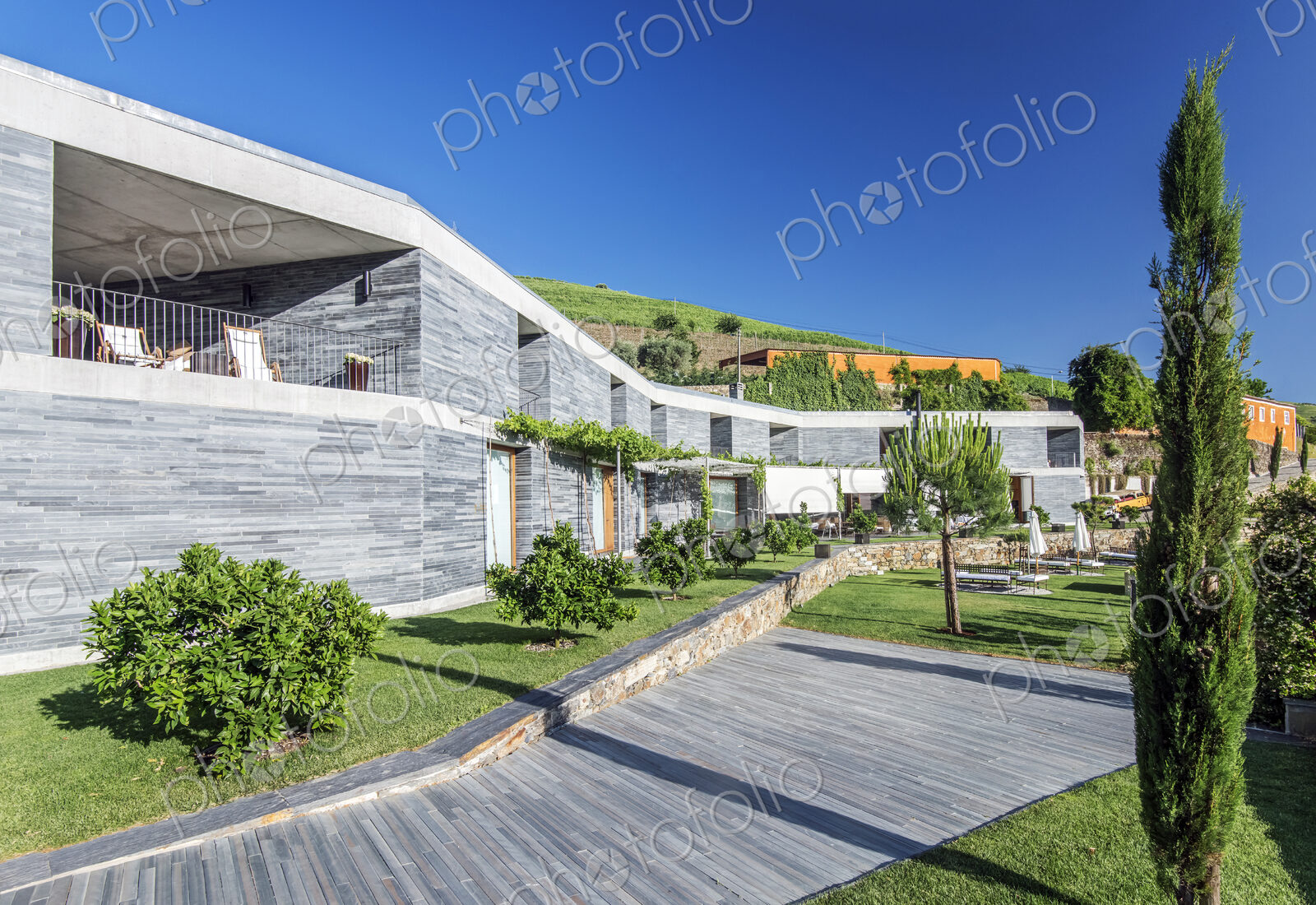 Modern hotel and wooden walkway
