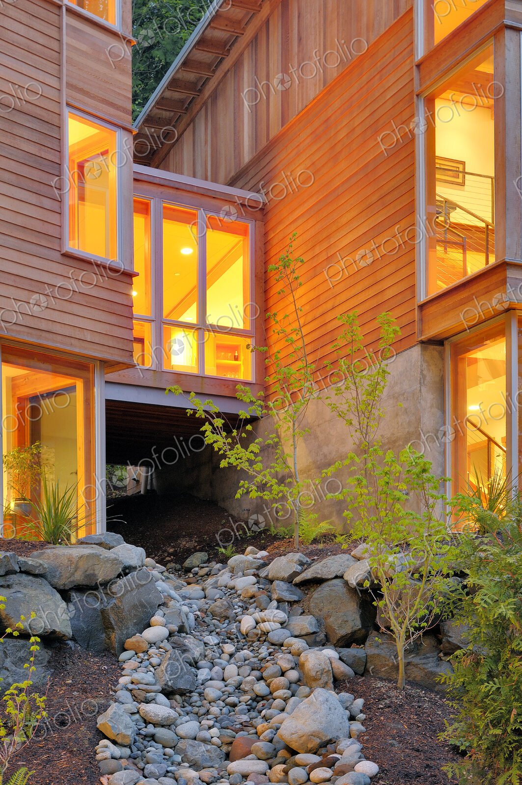 Modern house and rocky creek