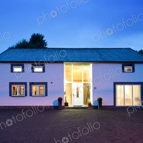 Modern house illuminated at twilight