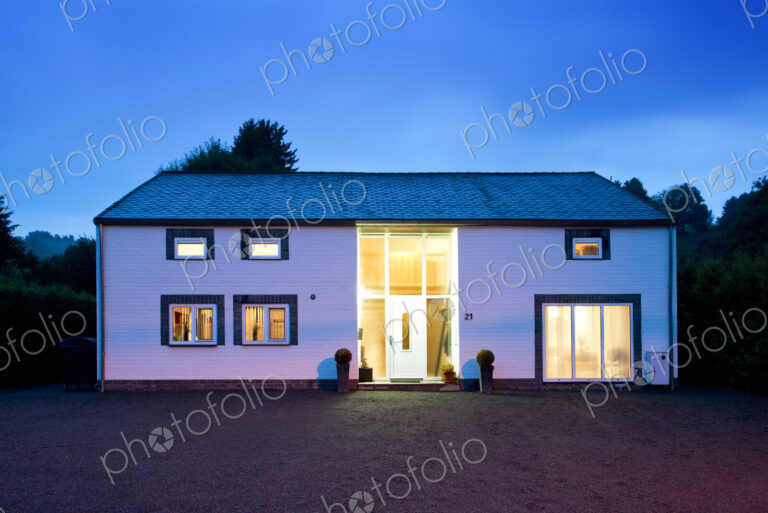 Modern house illuminated at twilight