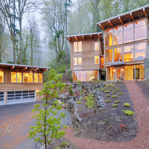 Modern house illuminated in woods Modern house illuminated in woods