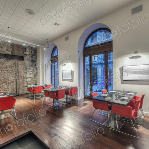 Modern restaurant interior with red chairs. Modern restaurant interior with red chairs.