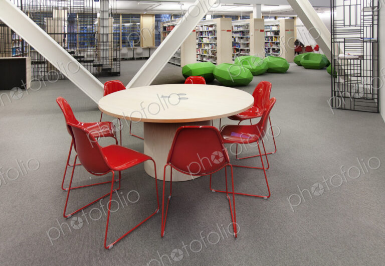 Modern study area at a college or university, bookshelves and public seating areas.