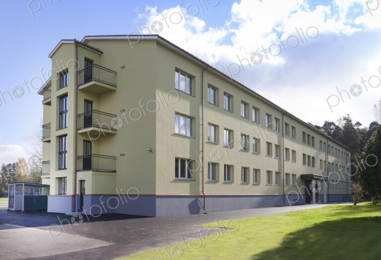 Modern youth hostel building, accommodation for travellers, building exterior.