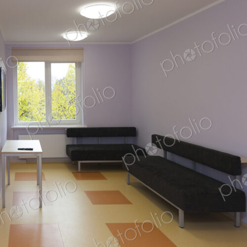 Modern youth hostel building. Black couches in a television room. Modern youth hostel building. Black couches in a television room.